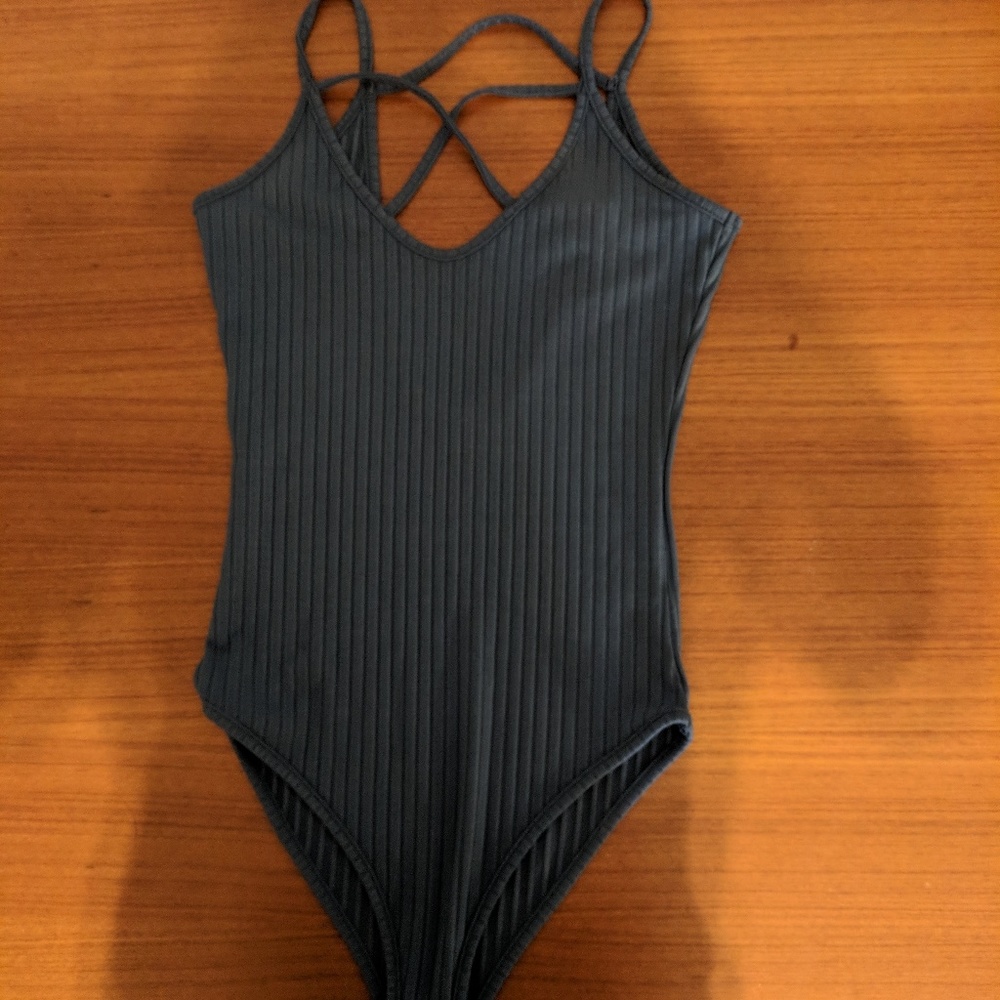 Blue strappy bodysuit.